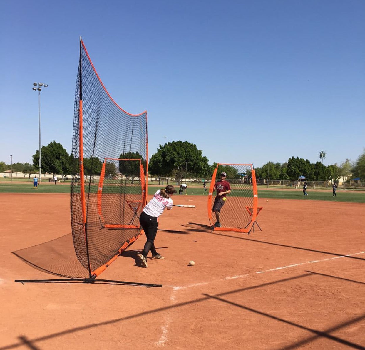 Bownet barrier net showing split-field usage with soccer goal on training area