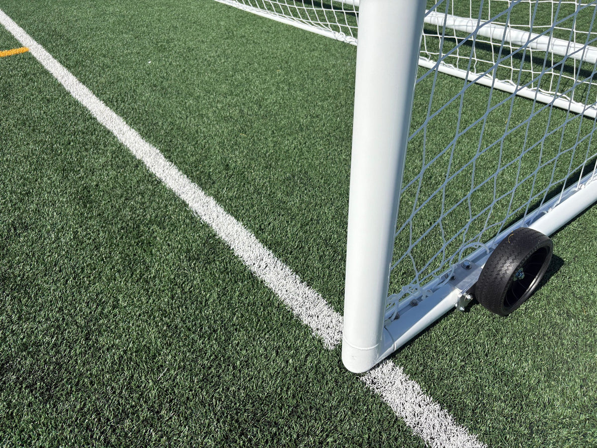 Professional PEVO Stadium Series portable soccer goal with boxed net design and flat-free wheels