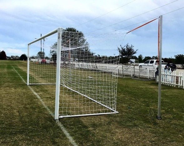 Full-size PEVO World Cup Series soccer goal with professional boxed net and deep ground stanchions