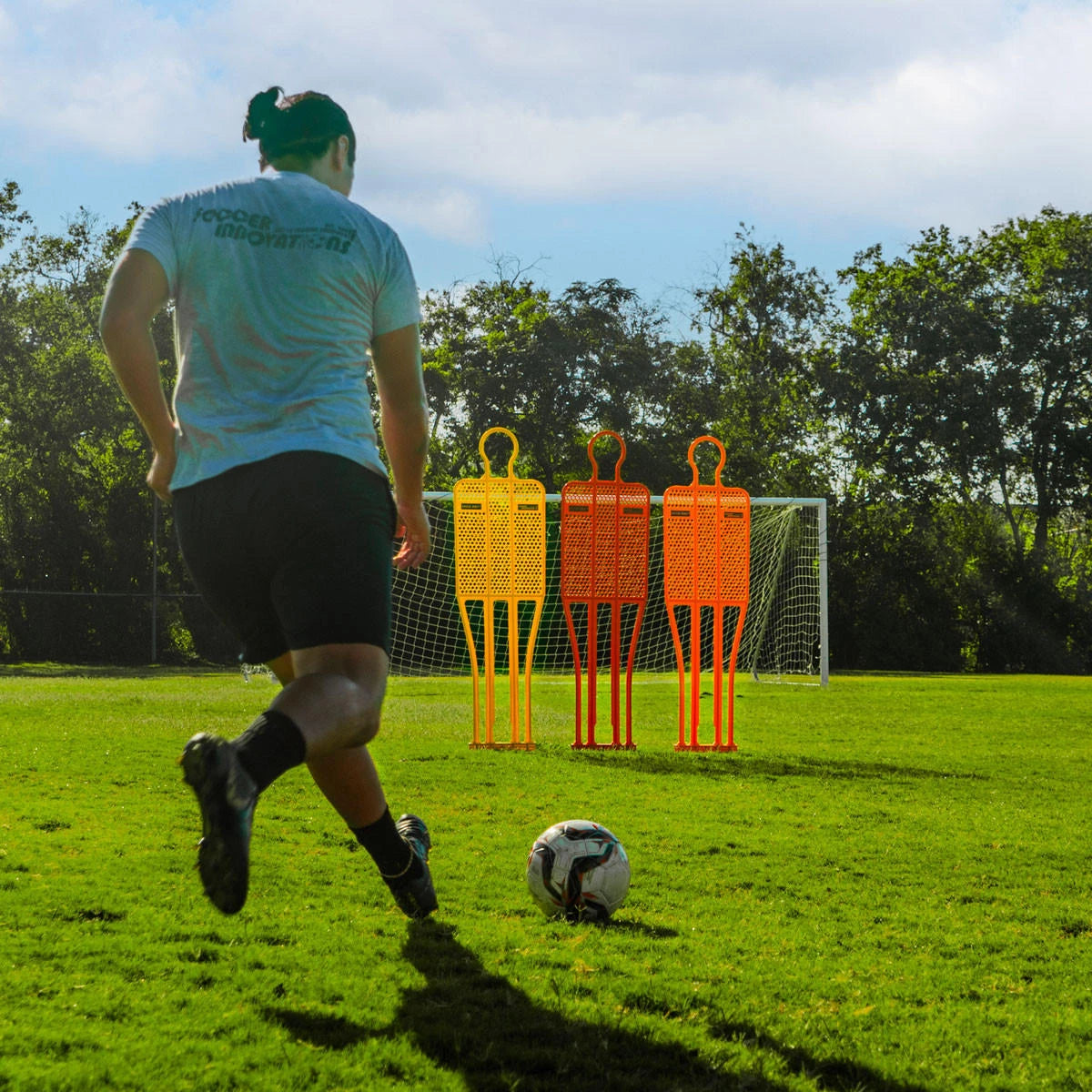 Soccer wall training mannequin with wind-resistant mesh body and telescoping pole