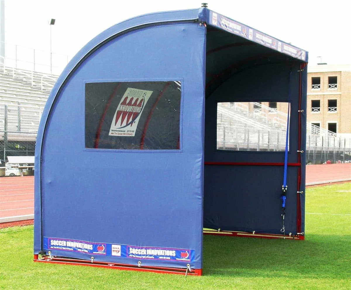 Sports shelter for referees and scorekeepers showing durable construction and field positioning
