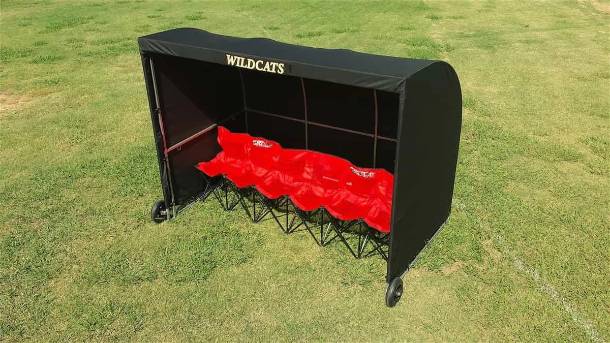 Sports referee shelter providing weather coverage for scorekeepers and officials on field