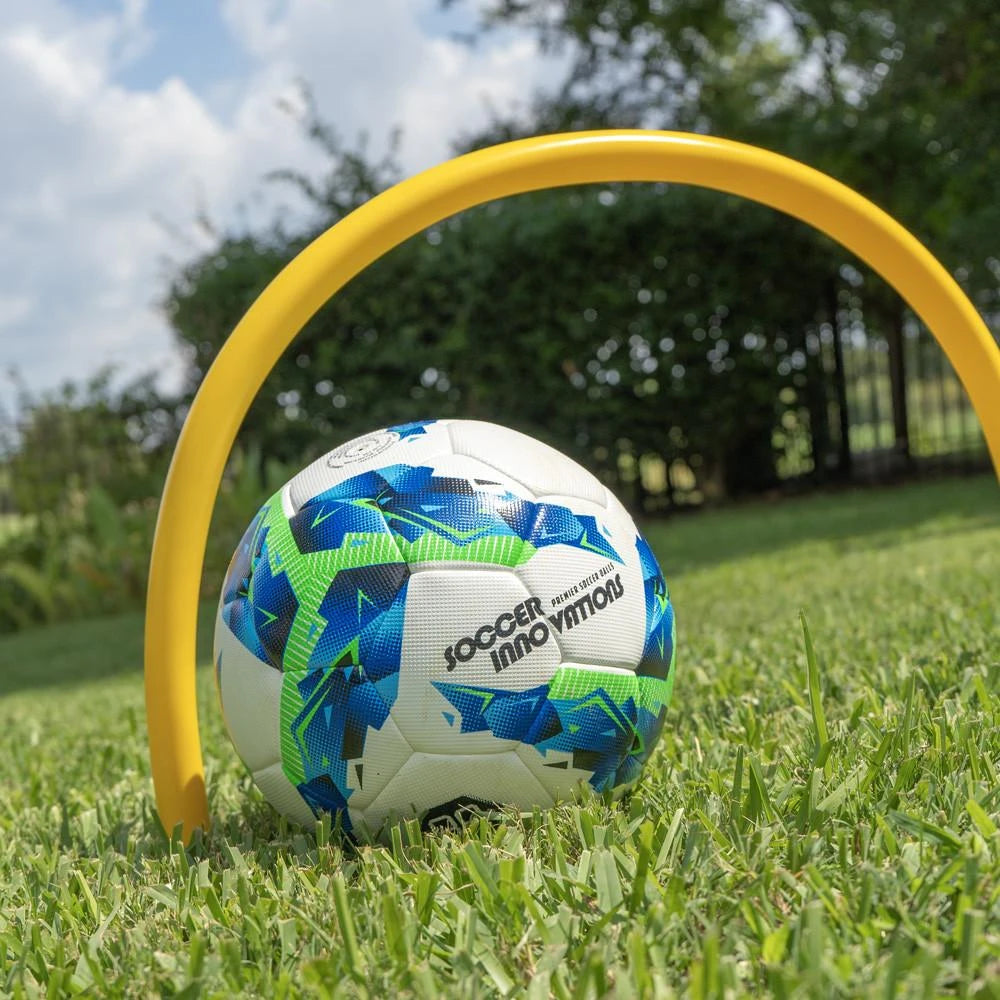 Soccer passing arc with ground spike base standing on field for training gate accuracy drills