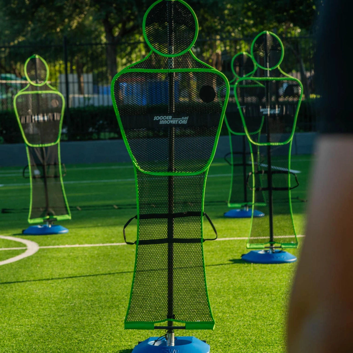 Soccer wall training mannequin with wind-resistant mesh body and telescoping pole