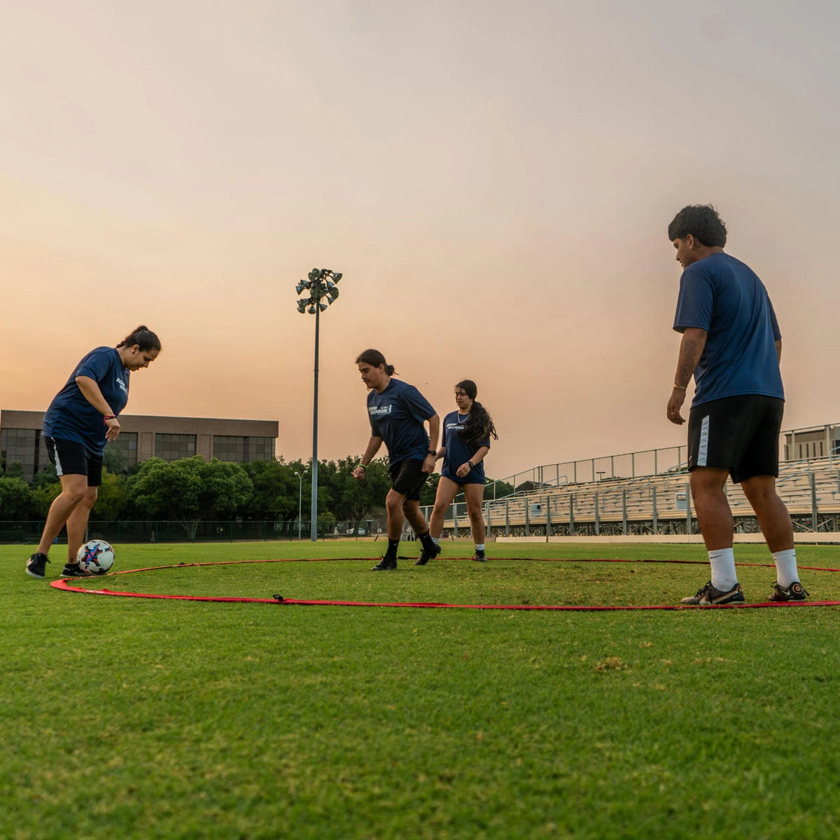 Team possession drill in tiki taka ring showing head-up awareness and quick decision-making