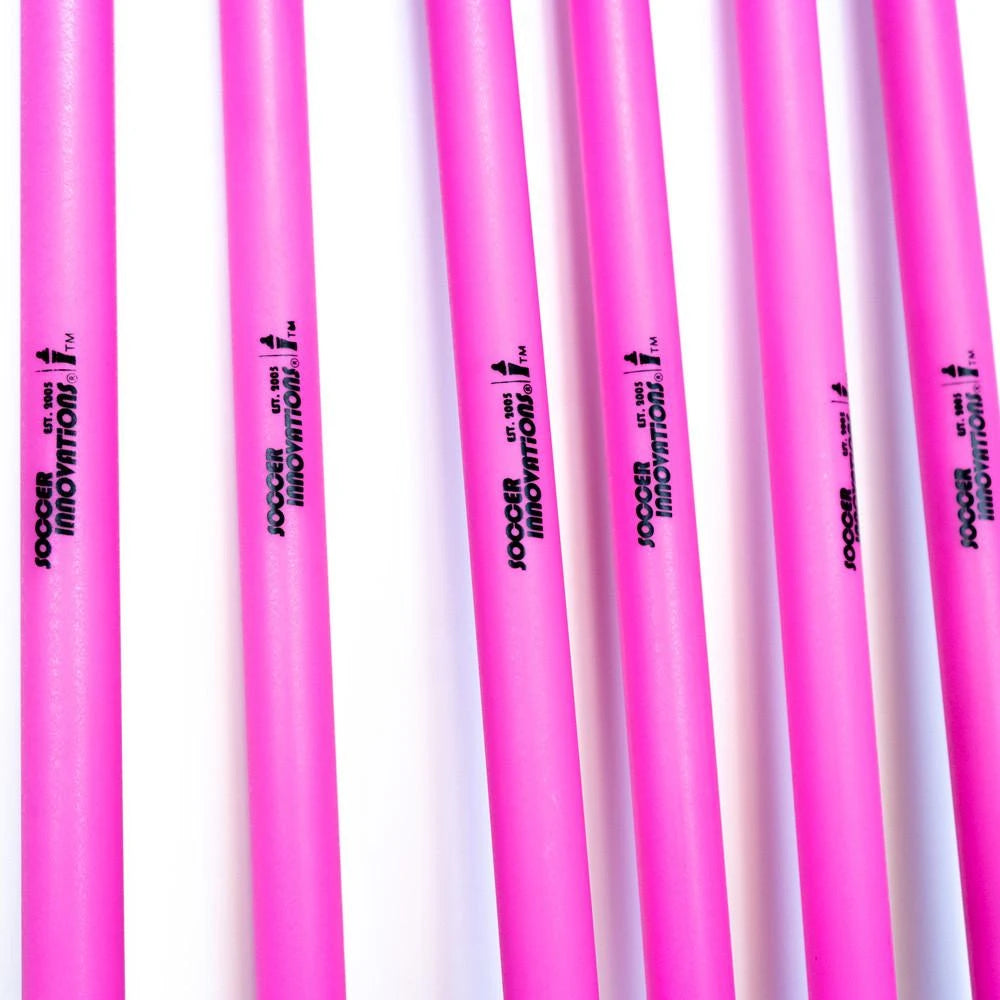 Pink unbreakable training agility pole with flexible PVC construction, standing position on ground