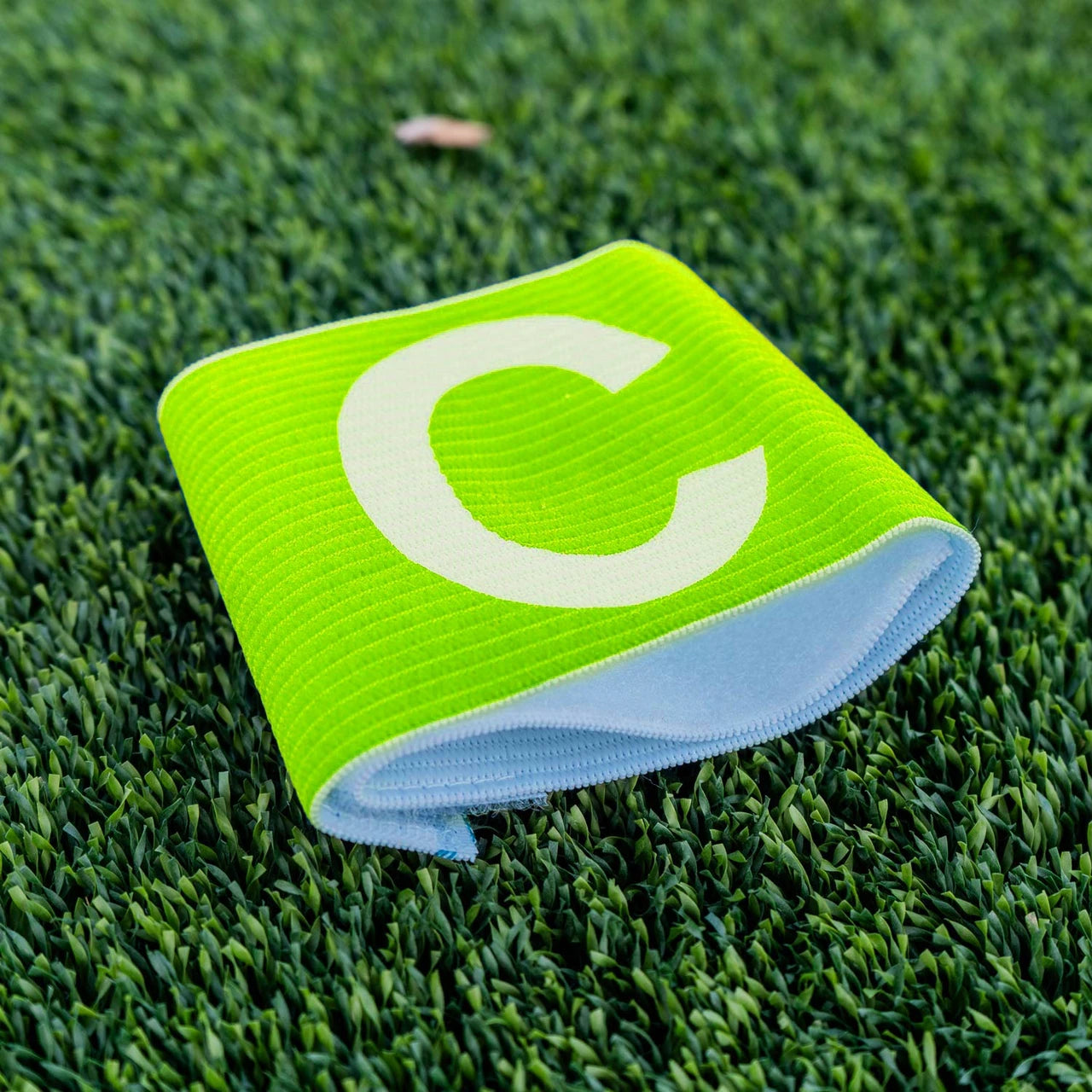 Soccer captain's armband with velcro closure, folded presentation showing construction detail and fastener